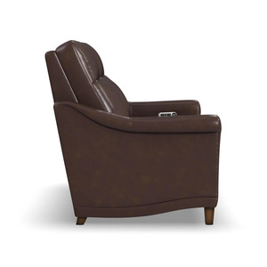 Close up traditional leather reclining loveseat nailhead trim detail