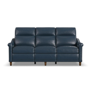 Close up traditional leather reclining sofa nailhead trim detail